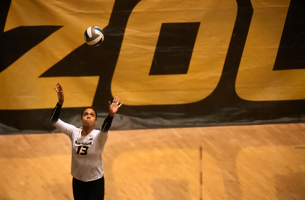 Senior Dariana Hollingsworth-Santana serves the ball